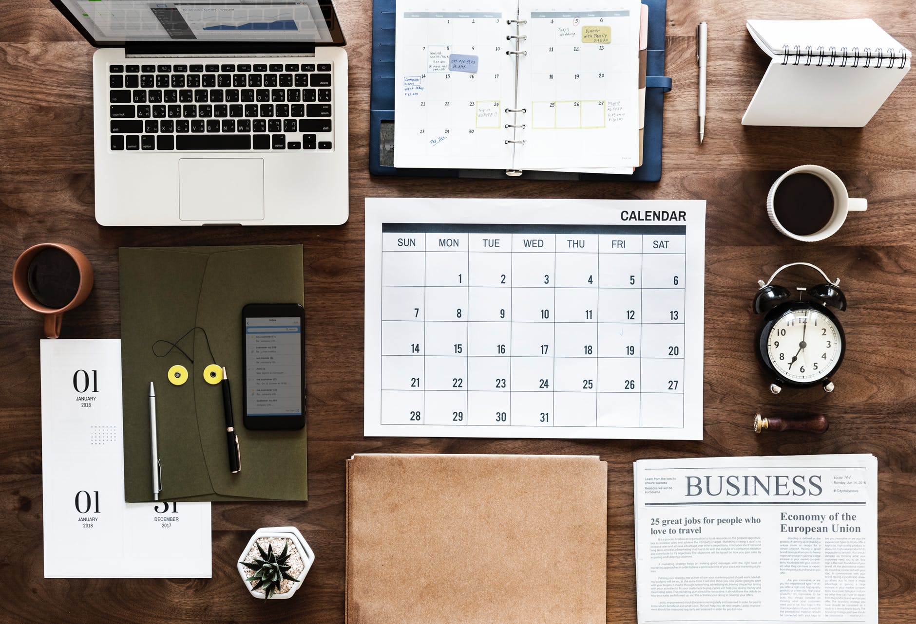 laptop calendar and books