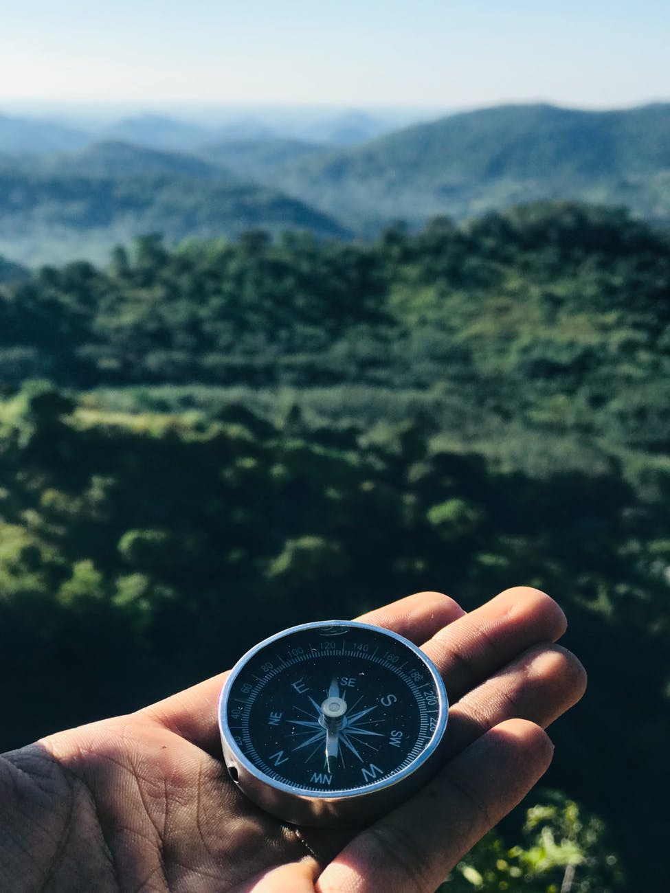 round grey and black compass