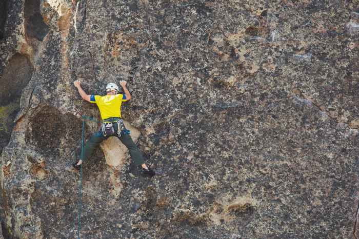 man doing outdoor rock climbing